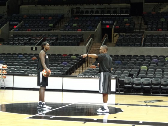 Coach James Wade at practice with Sophia Young